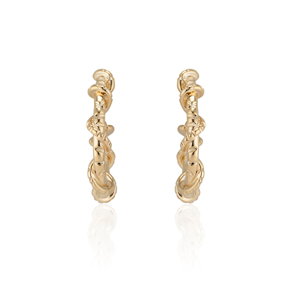 Edgy and fun, these mid sized Spike Hoops feature Natalie McMillan's signature etchings with a literal twist. They are made of solid 14k Gold, so you can wear them every day for a lifetime! 