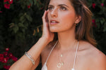 Load image into Gallery viewer, Dainty, sweet, and delicate. The Natalie McMillan Stella Necklace is the perfect necklace to wear every day and keep close to your heart. Its 14k gold pendant hangs on a delicate gold chain.
